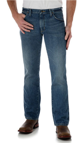 77MWZWO Worn-In Vintage Patch Slim Fit Boot Cut Wrangler Mens Jeans